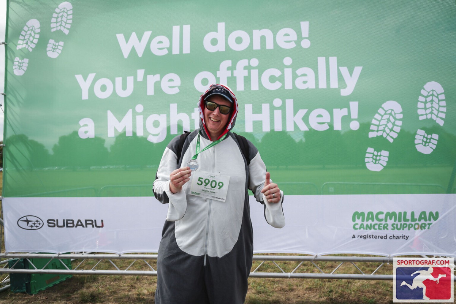 Luke completing the Macmillan Mighty Hike dressed as a shark
